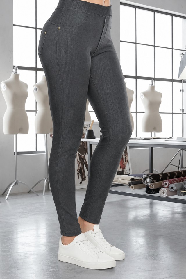 Magic Pant Charcoal Gray detail in the signature atelier setting, with white sneakers.