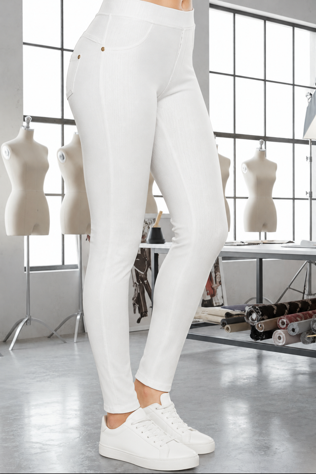 White Magic Pants detail in the signature atelier setting, with white sneakers.