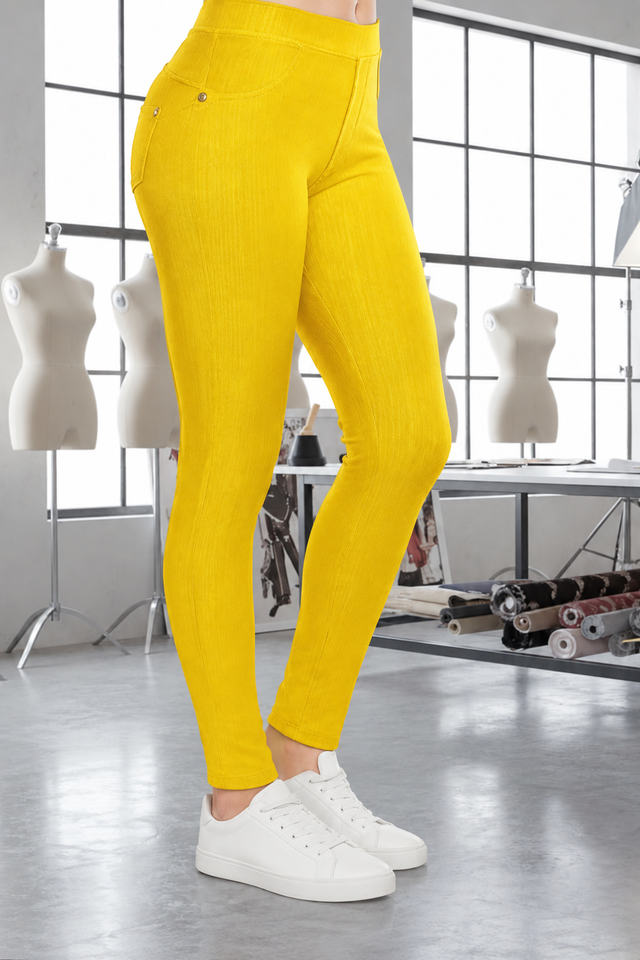 Magic Pant Yellow detail in the signature atelier setting, with white sneakers.