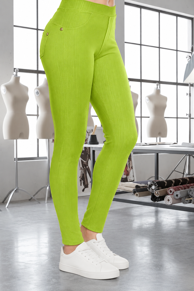 Magic Pant Green Apple detail in the signature atelier setting, with white sneakers.