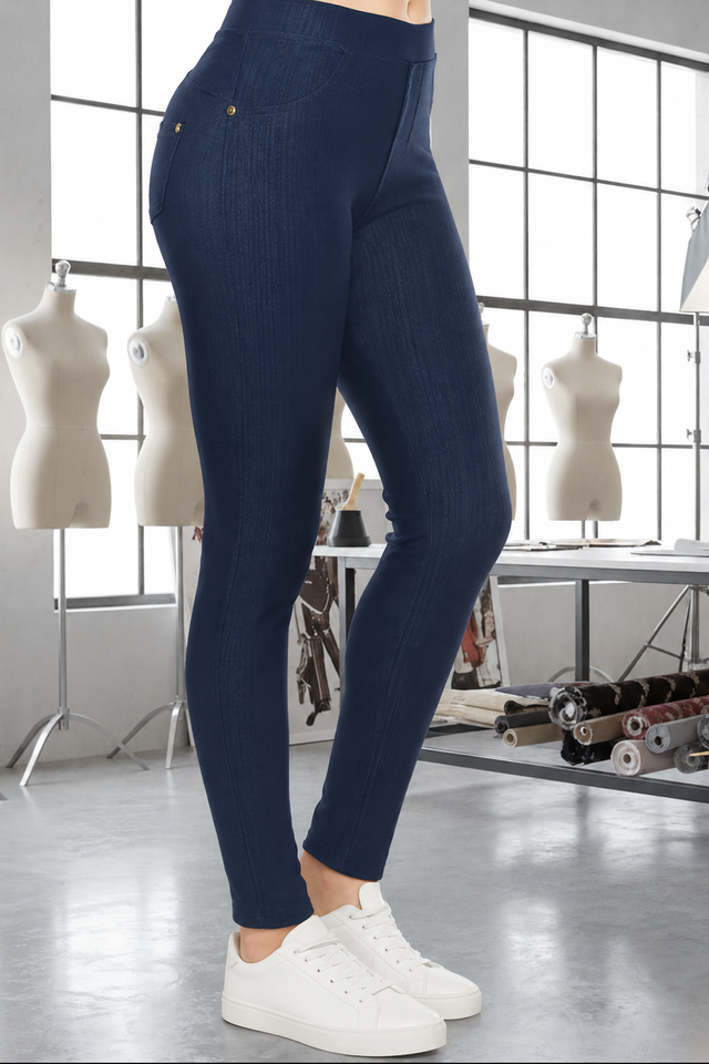 Magic Pant Navy detail in the signature atelier setting, with white sneakers.